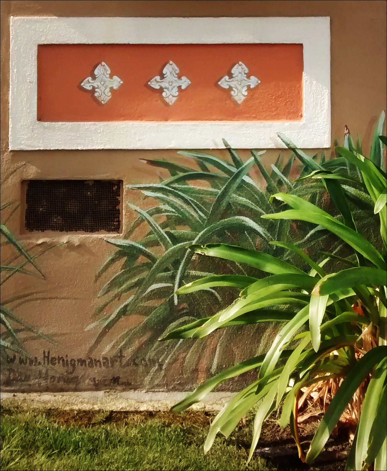 Repeating plants, trompe l'oeil, on an apartment bilding wall.